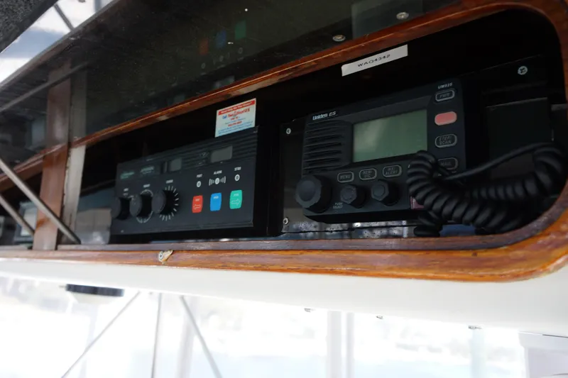 The Dog House Yacht Photos Pics 1988 Ocean Yachts Super Sport radio equipment in wooden console.