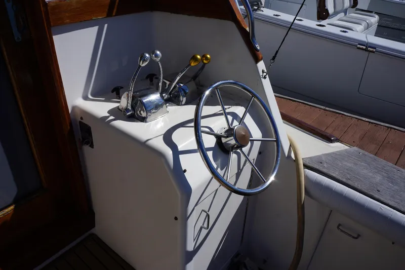 The Dog House Yacht Photos Pics 1988 Ocean Yachts Super Sport helm with steering wheel and controls.