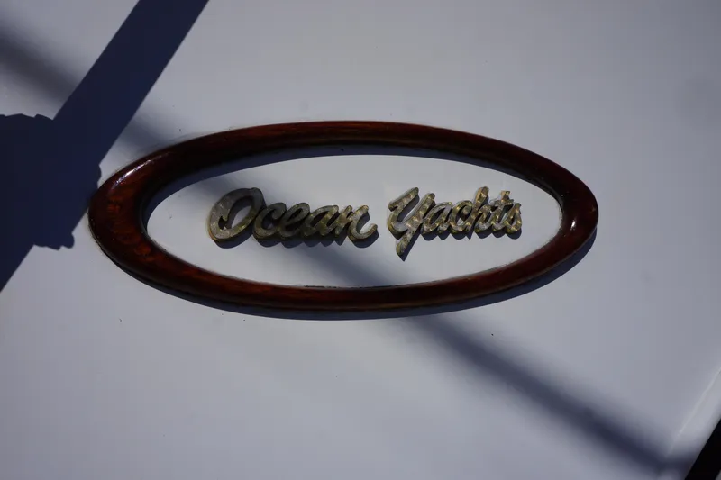 The Dog House Yacht Photos Pics 1988 Ocean Yachts Super Sport logo on a white surface.