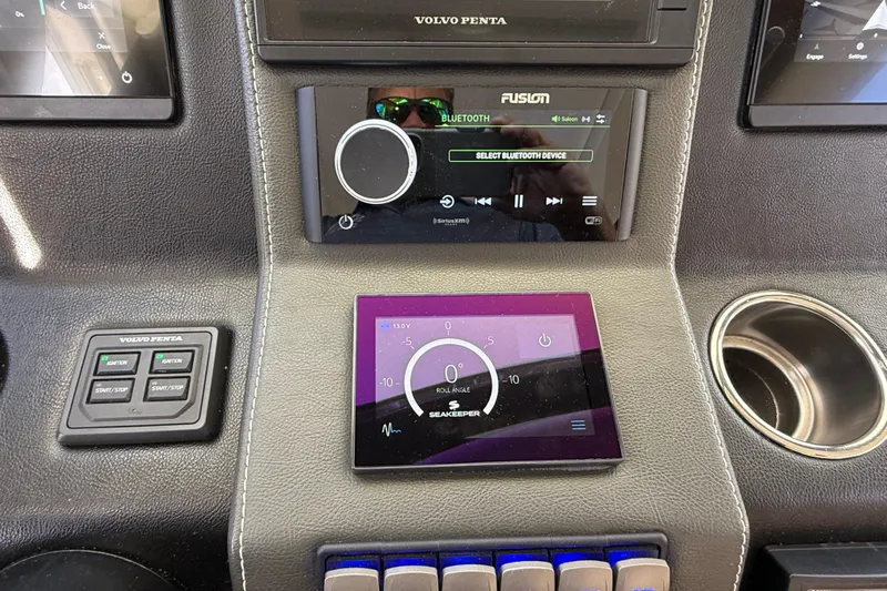  Yacht Photos Pics Control panel of 2021 Riviera 395 SUV with Bluetooth and navigation displays.