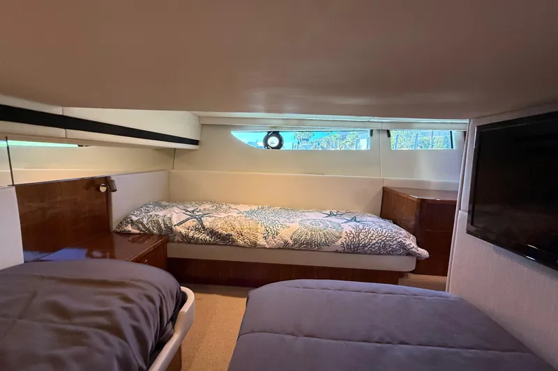  Yacht Photos Pics Interior cabin of 2021 Riviera 395 SUV with twin beds and modern decor.