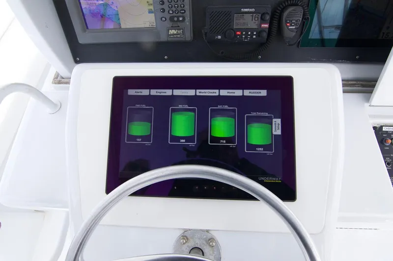 Grape Escape Yacht Photos Pics Control panel of a 2000 Hatteras 60 Convertible yacht with digital displays.