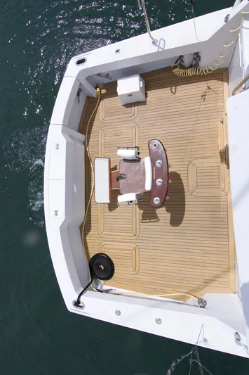Grape Escape Yacht Photos Pics Aerial view of 2000 Hatteras 60 Convertible yacht deck with fishing chair.