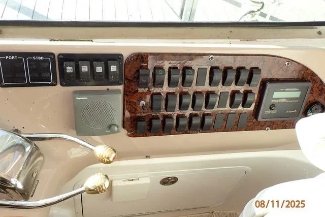 Yacht Photos Pics Control panel of a 2003 Sea Ray Sundancer 460 yacht with switches and gauges.