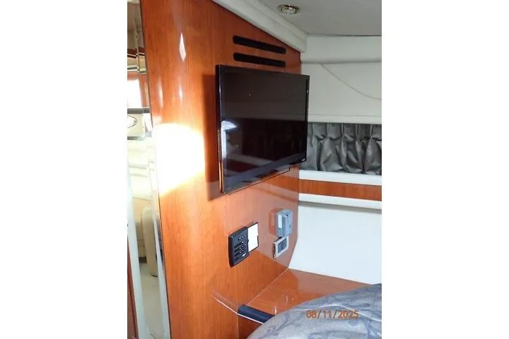  Yacht Photos Pics Interior of 2003 Sea Ray Sundancer 460 with mounted TV and wooden paneling.