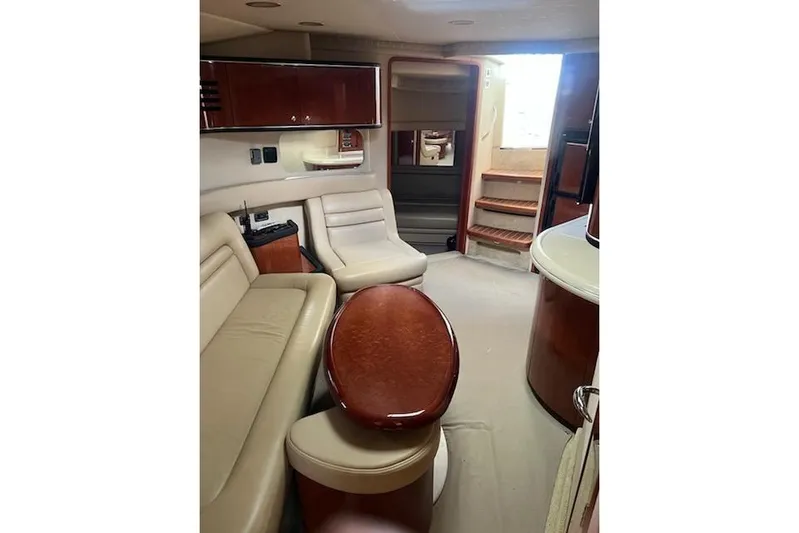  Yacht Photos Pics Interior of 2003 Sea Ray Sundancer 460 yacht with elegant seating and wooden finishes.