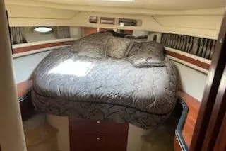  Yacht Photos Pics Luxurious cabin interior of 2003 Sea Ray Sundancer 460 yacht with plush bedding.