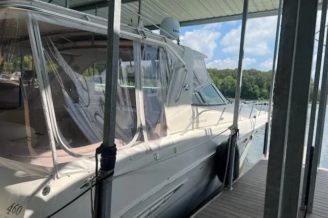  Yacht Photos Pics 2003 Sea Ray Sundancer 460 docked under a covered marina with clear skies.