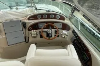  Yacht Photos Pics 2003 Sea Ray Sundancer 460 helm with gauges, steering wheel, and controls.