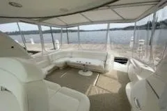  Yacht Photos Pics 2003 Sea Ray Sundancer 460 yacht interior with white seating and panoramic water views.