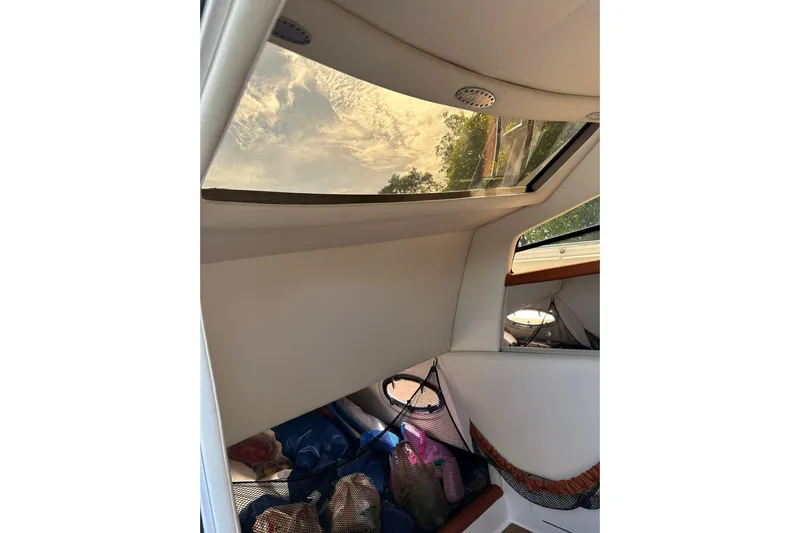  Yacht Photos Pics Interior view of 2015 Nor-Tech 390 Sport Center Console boat with skylight and storage area.