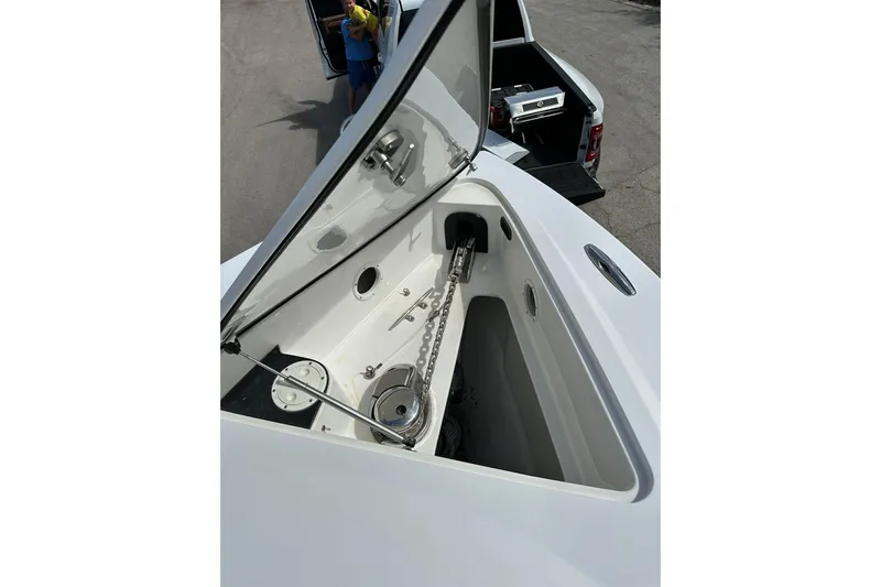  Yacht Photos Pics 2015 Nor-Tech 390 Sport Center Console anchor compartment, open lid, showing chain and mechanism.