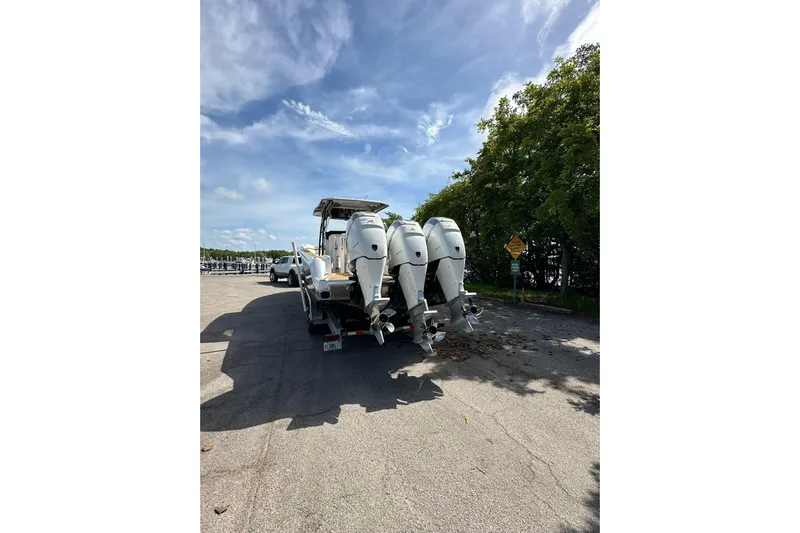  Yacht Photos Pics 2015 Nor-Tech 390 Sport Center Console boat with triple outboard engines on a trailer.