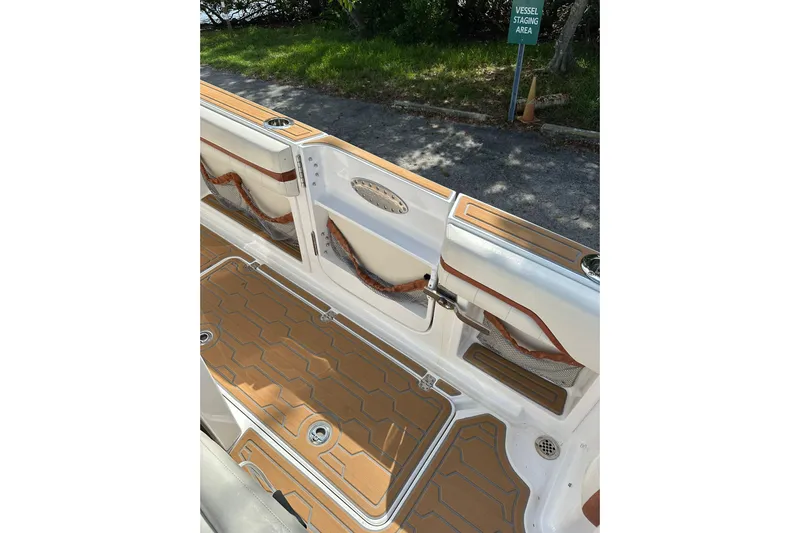  Yacht Photos Pics 2015 Nor-Tech 390 Sport Center Console interior with teak flooring and storage compartments.