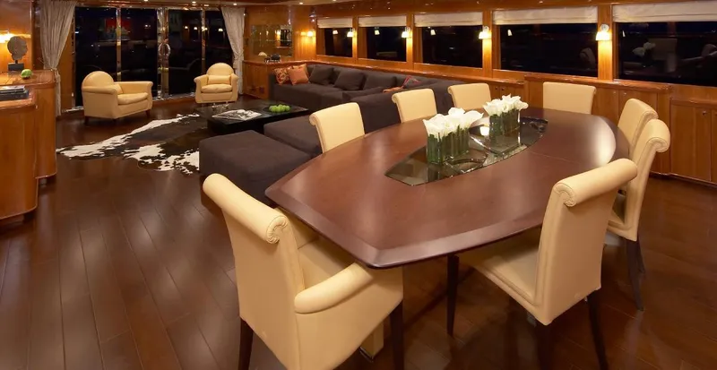 White Shark Yacht Photos Pics Luxurious yacht interior with elegant dining area, plush seating, and modern decor, Johnson 105, 2008.