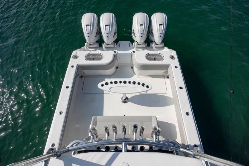  Yacht Photos Pics 2023 SeaHunter 46 CTS boat with four powerful outboard engines on turquoise water.