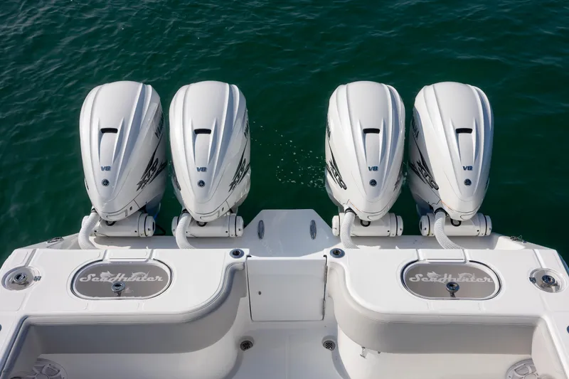  Yacht Photos Pics Four powerful outboard engines on a 2023 SeaHunter 46 CTS boat.