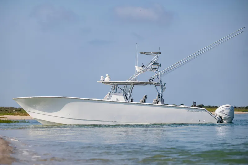  Yacht Photos Pics 2023 SeaHunter 46 CTS boat on calm water, side view.