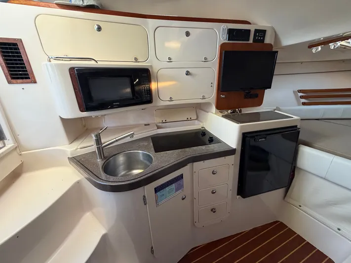 Genau II Yacht Photos Pics Interior of 2004 Grady-White Express 330 yacht kitchen.