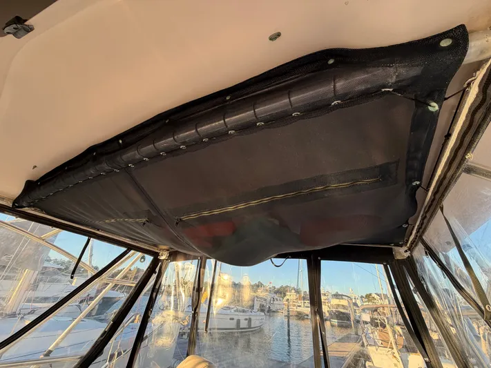 Genau II Yacht Photos Pics Interior view of a 2004 Grady-White Express 330 boat with harbor view.