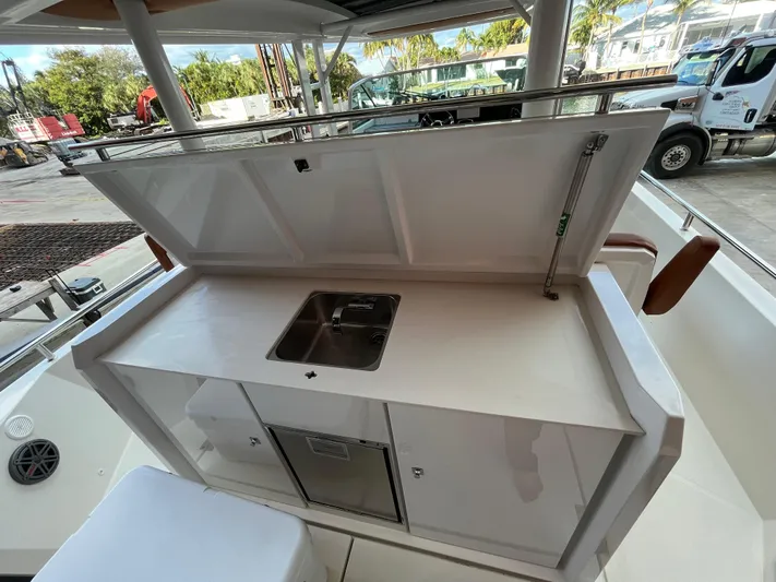 Special !! Call For Details! Yacht Photos Pics 2018 Axopar 370 SUN TOP boat kitchenette with sink and storage.