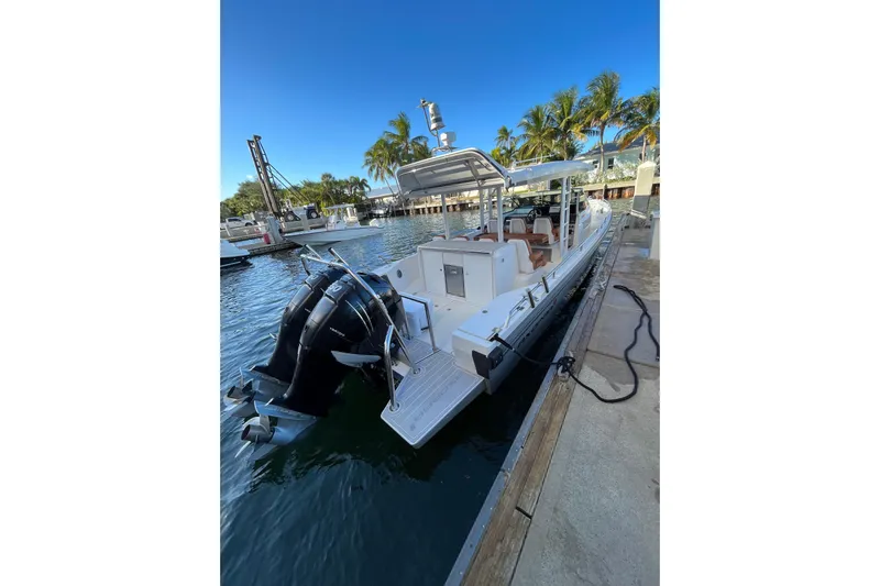 Special !! Call For Details! Yacht Photos Pics 2018 Axopar 370 SUN TOP boat docked, featuring dual outboard motors and sleek design.