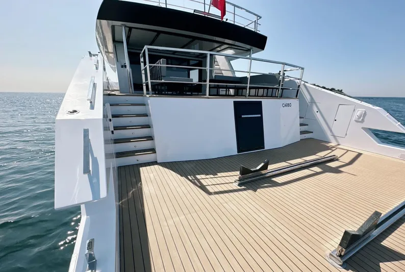  Yacht Photos Pics Luxurious 2023 Carboyacht 90 on open water, featuring spacious deck and modern design.
