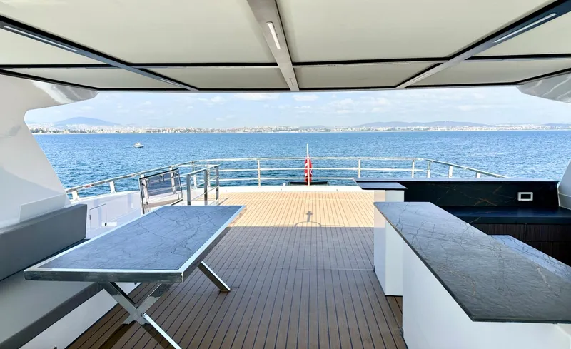  Yacht Photos Pics Luxurious 2023 Carboyacht 90 deck with ocean view and modern furnishings.