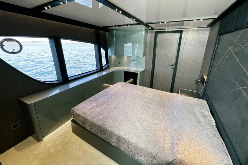  Yacht Photos Pics Luxurious bedroom interior of 2023 Carboyacht 90 with ocean view windows.