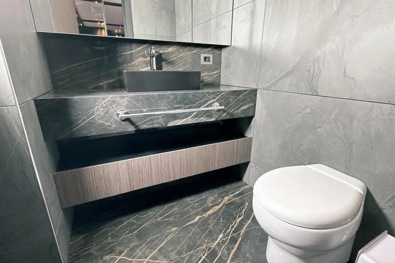  Yacht Photos Pics Luxurious bathroom in 2023 Carboyacht 90 with modern fixtures and marble design.