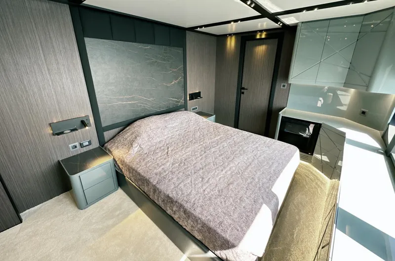  Yacht Photos Pics Luxurious bedroom interior of 2023 Carboyacht 90, featuring modern design and elegant furnishings.