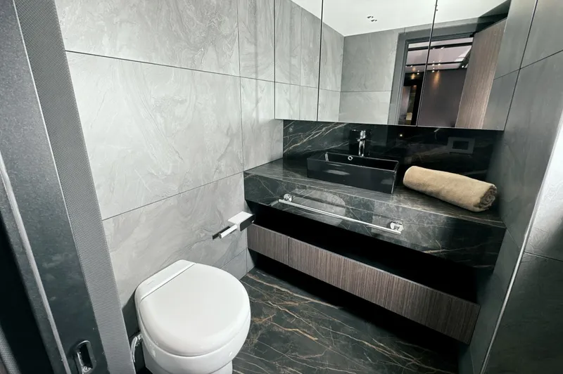  Yacht Photos Pics Luxurious bathroom in 2023 Carboyacht 90, featuring modern fixtures and elegant design.