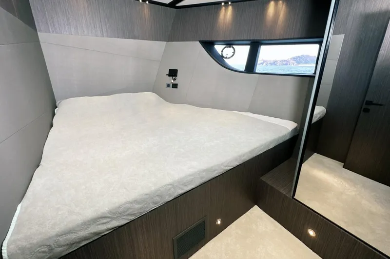  Yacht Photos Pics Luxurious cabin interior of 2023 Carboyacht 90 with modern design and large bed.