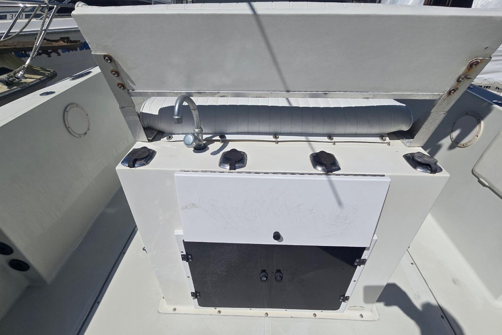 1997 Stamas 270 Tarpon boat interior with sink and storage compartments.