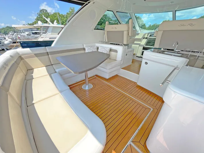  Yacht Photos Pics Luxurious 2012 Sea Ray 450 Sundancer yacht interior with elegant seating and wooden flooring.