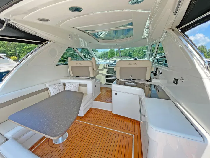 Yacht Photos Pics Luxurious interior of 2012 Sea Ray 450 Sundancer yacht with sleek design and wood flooring.