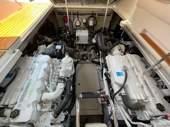 Yacht Photos Pics Engine room of 2012 Sea Ray 450 Sundancer yacht, showcasing dual engines and mechanical components.