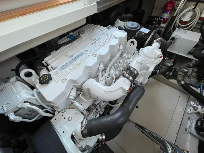  Yacht Photos Pics Engine compartment of 2012 Sea Ray 450 Sundancer boat, showcasing detailed machinery and components.