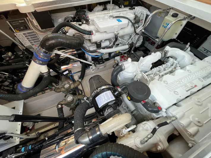  Yacht Photos Pics Engine room of 2012 Sea Ray 450 Sundancer, showcasing complex mechanical components.