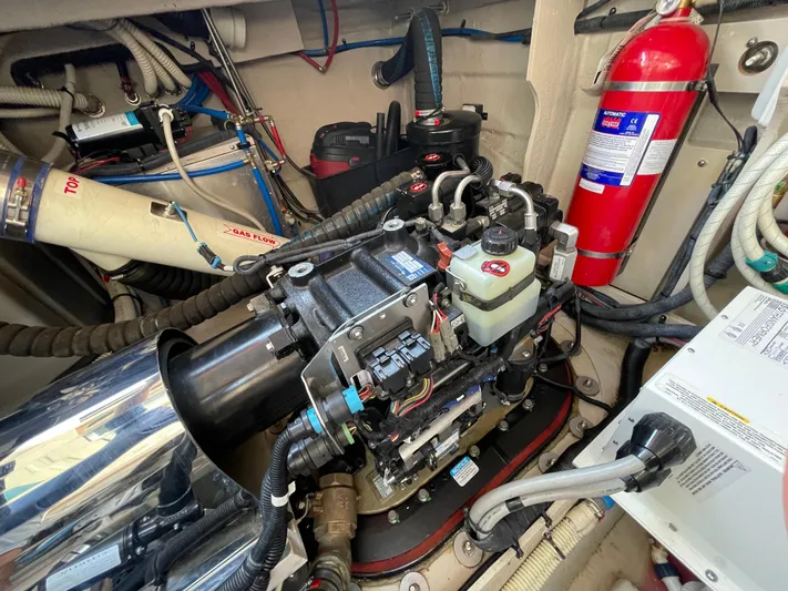  Yacht Photos Pics Engine room of 2012 Sea Ray 450 Sundancer with fire extinguisher and mechanical components.