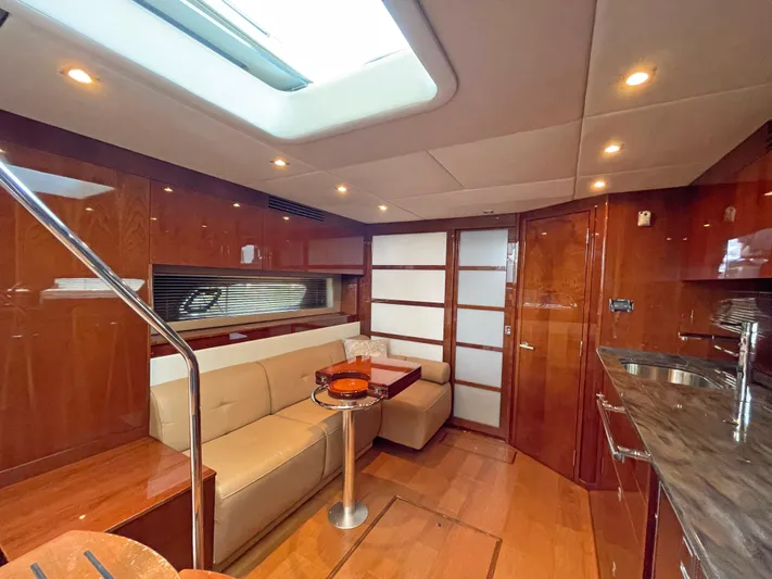  Yacht Photos Pics Luxurious interior of 2012 Sea Ray 450 Sundancer yacht with elegant wood finishes.