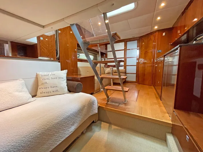  Yacht Photos Pics Luxurious interior of 2012 Sea Ray 450 Sundancer yacht with wooden finishes and cozy seating.
