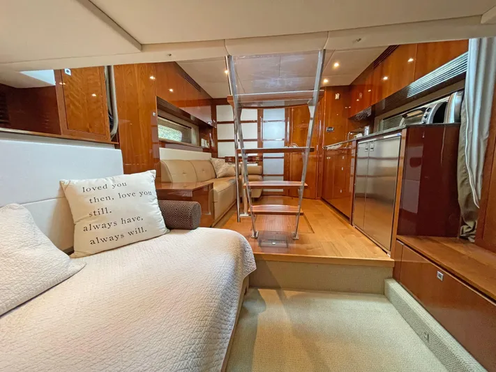  Yacht Photos Pics Luxurious interior of 2012 Sea Ray 450 Sundancer yacht with modern kitchen and cozy seating.