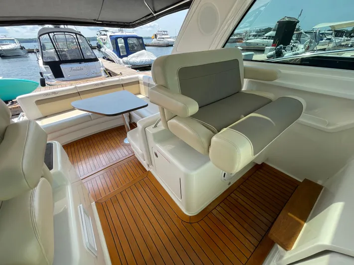  Yacht Photos Pics Luxurious 2012 Sea Ray 450 Sundancer yacht interior with plush seating and wooden flooring.