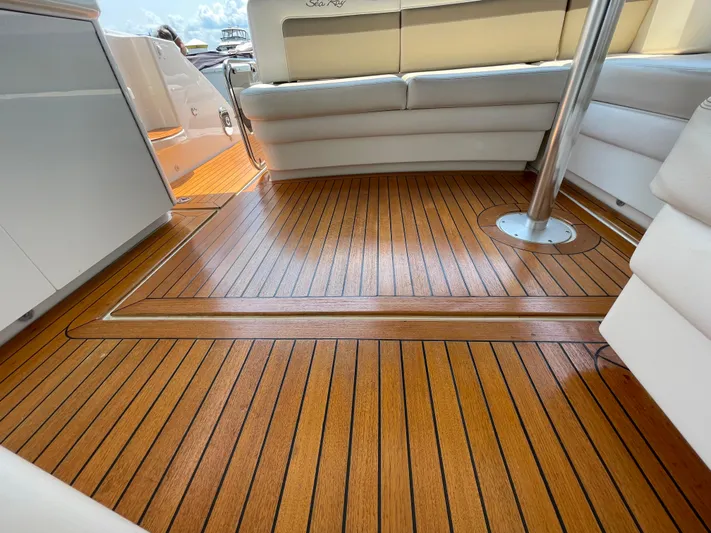  Yacht Photos Pics Luxurious 2012 Sea Ray 450 Sundancer yacht with elegant teak flooring and plush seating.