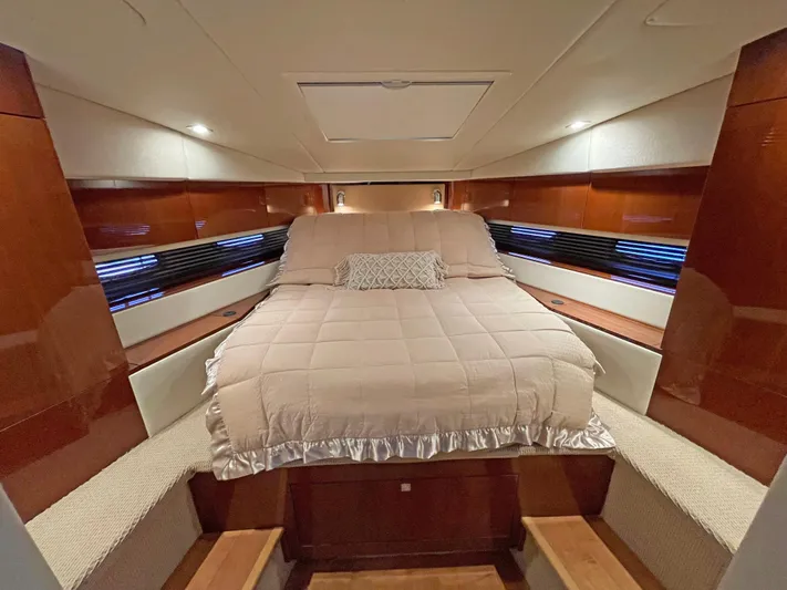  Yacht Photos Pics Luxurious cabin interior of 2012 Sea Ray 450 Sundancer yacht with elegant bedding.