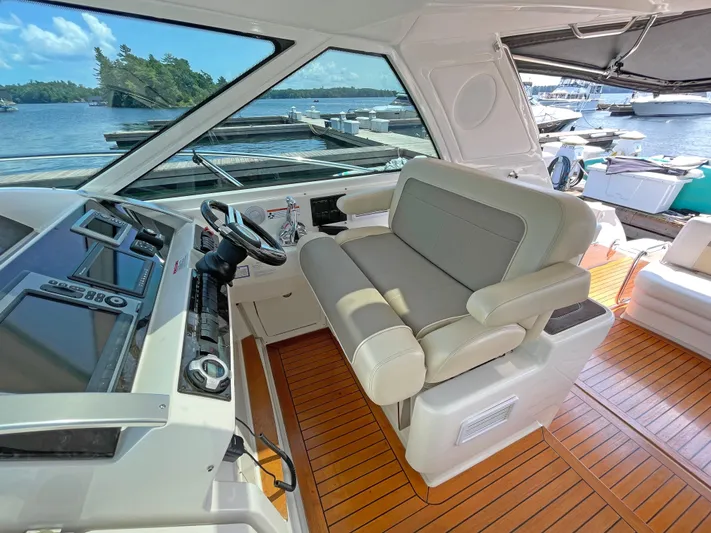  Yacht Photos Pics 2012 Sea Ray 450 Sundancer helm with plush seating and modern controls.