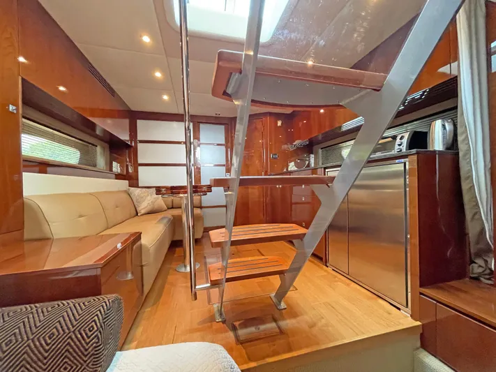  Yacht Photos Pics Luxurious interior of 2012 Sea Ray 450 Sundancer yacht with modern kitchen and seating area.