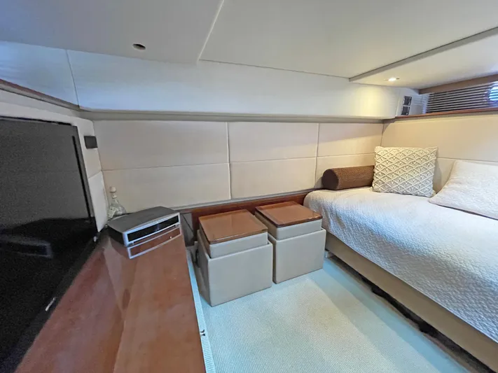  Yacht Photos Pics Interior cabin of 2012 Sea Ray 450 Sundancer yacht, featuring bed and TV.