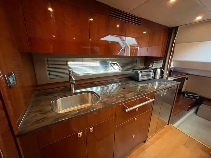  Yacht Photos Pics Luxurious kitchen interior of 2012 Sea Ray 450 Sundancer yacht with modern amenities.